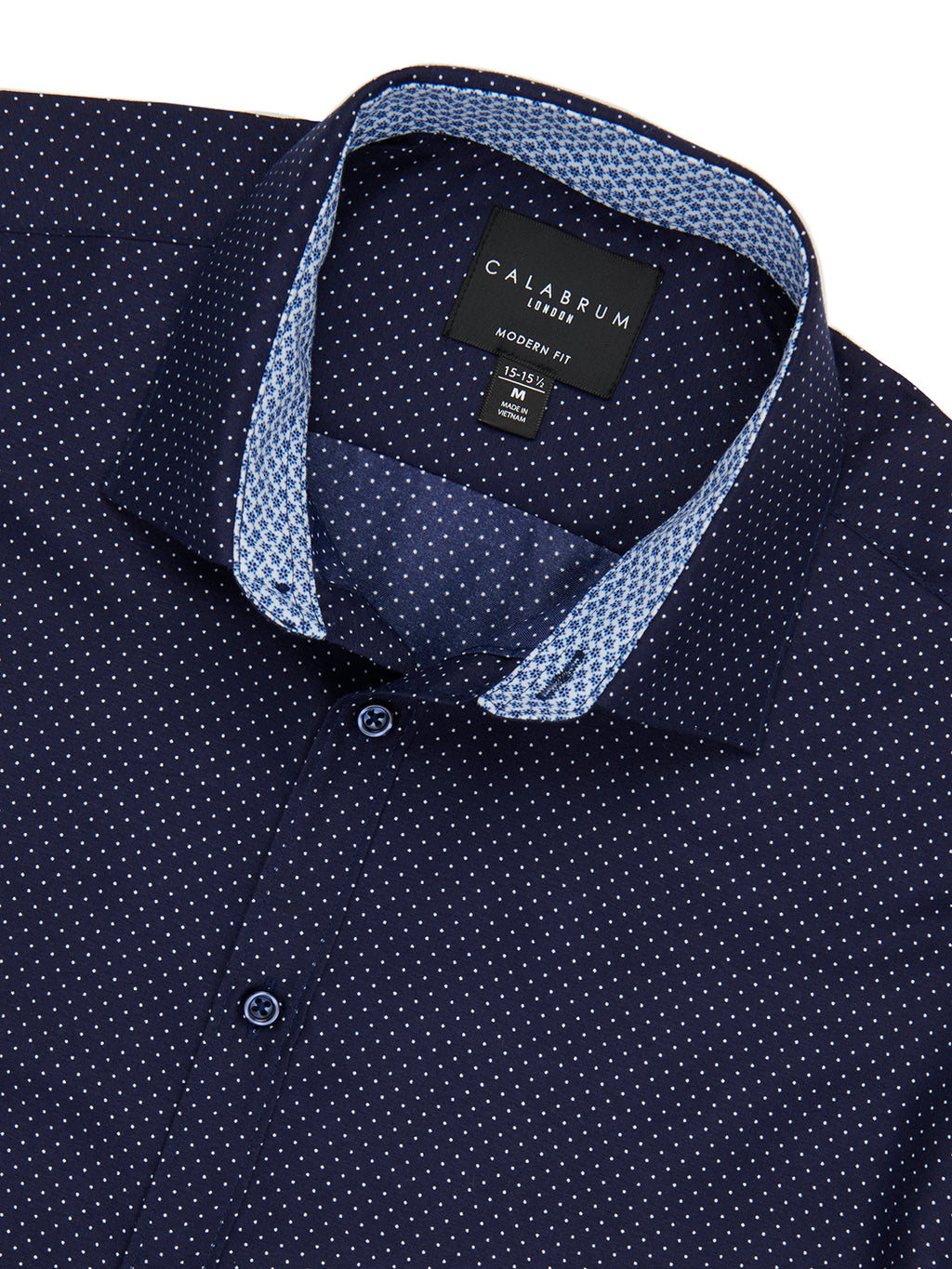 Navy blue shirt with white polka dot pattern and 'Calssrum' label on collar.