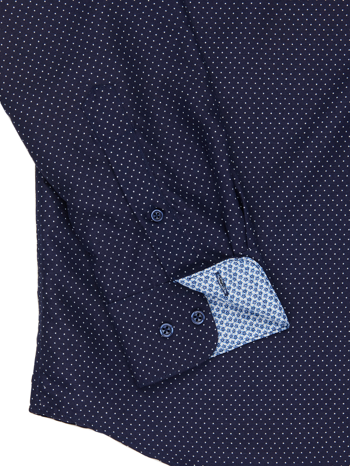 Navy blue shirt with white polka dot pattern on a white background