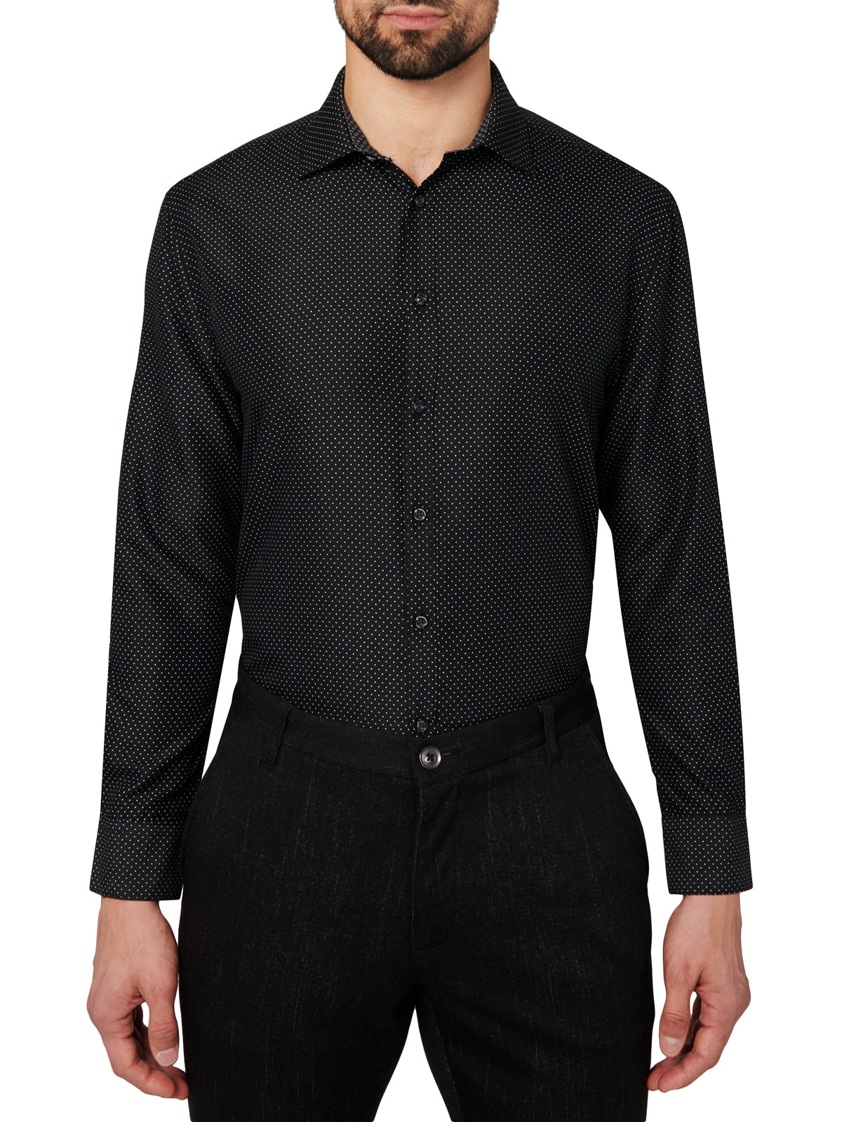 Man wearing a black patterned dress shirt and pants on a white background