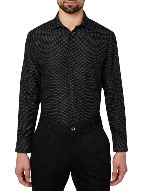 Man wearing a black patterned dress shirt and pants on a white background