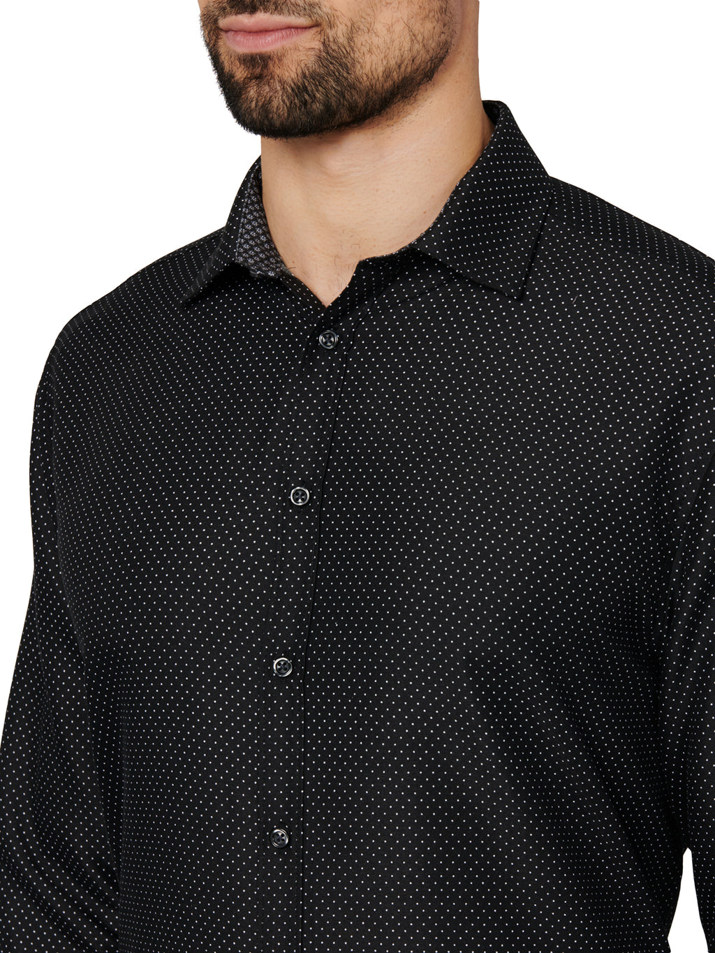 Black patterned shirt worn by a person on a white background
