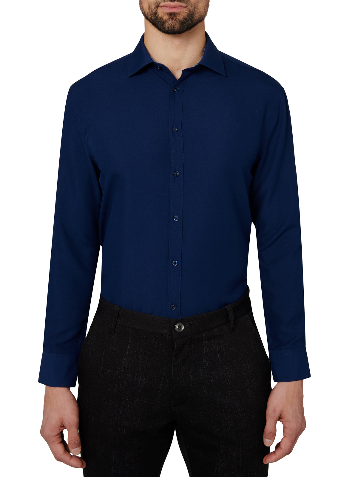 Man wearing a navy blue dress shirt and black pants on a white background