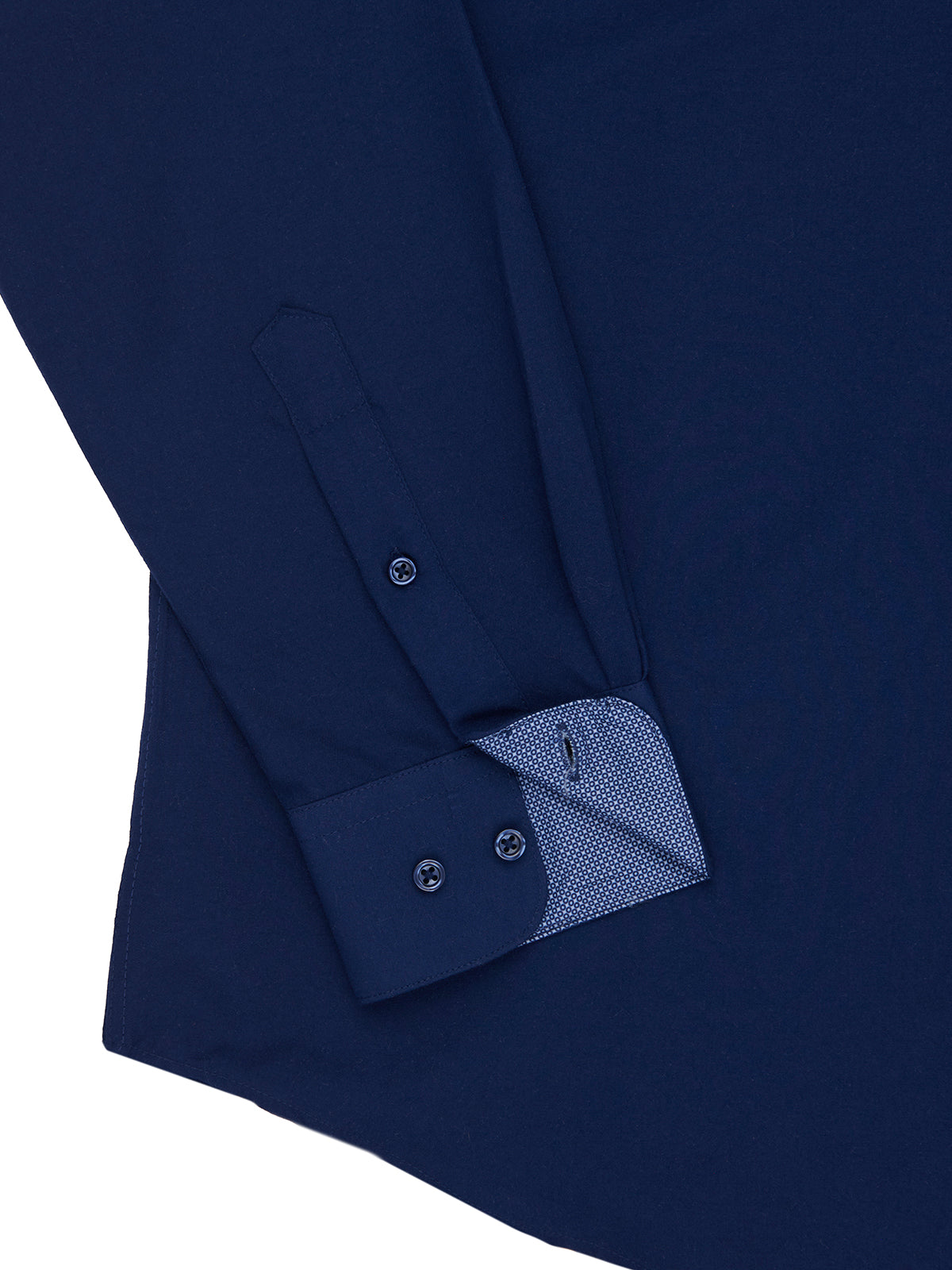 Close-up of a navy blue shirt with a buttoned cuff on a white background