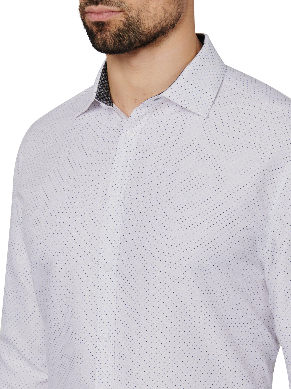 Close-up of a patterned shirt worn by a person on a white background