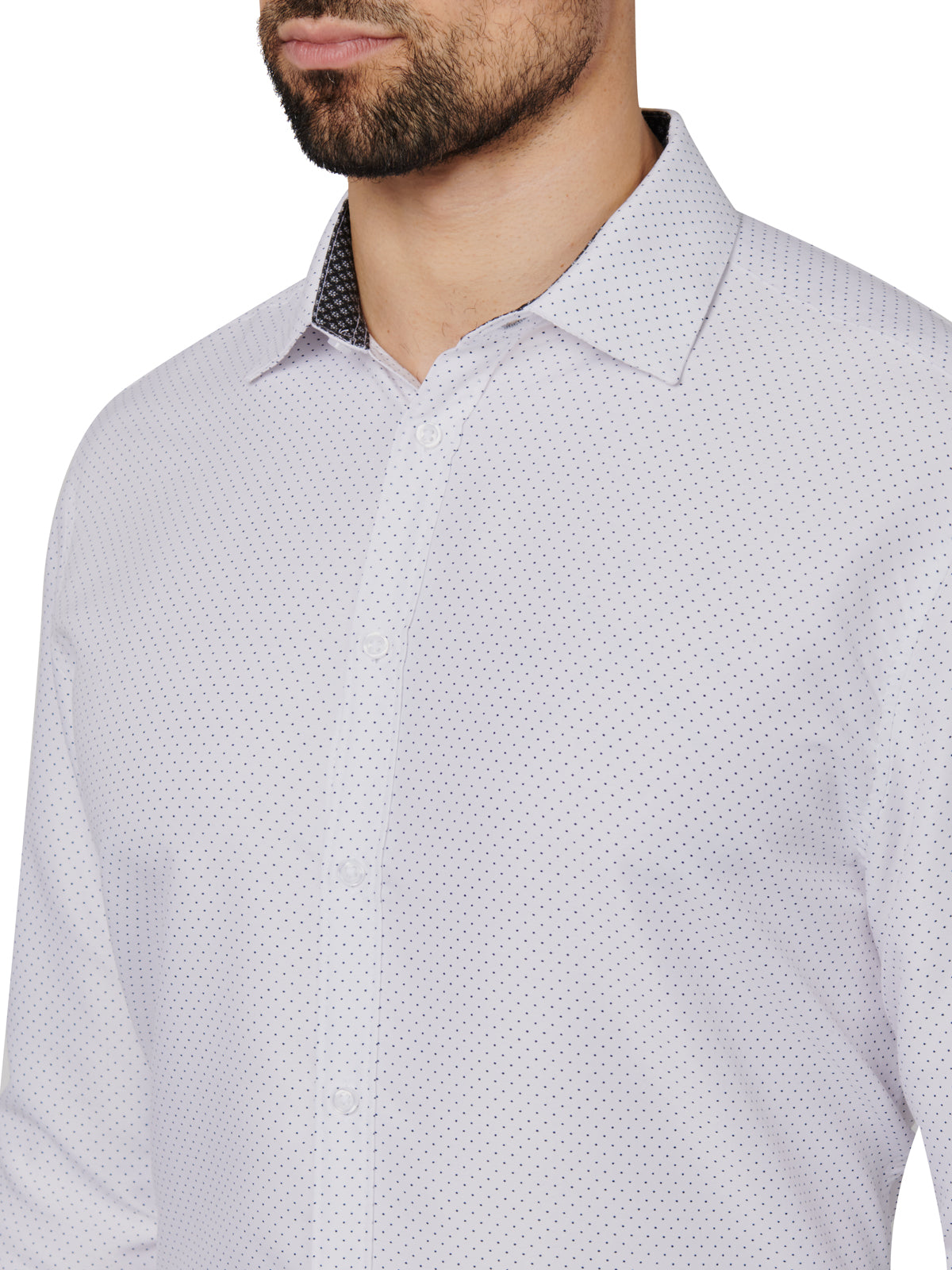 Close-up of a patterned shirt worn by a person on a white background