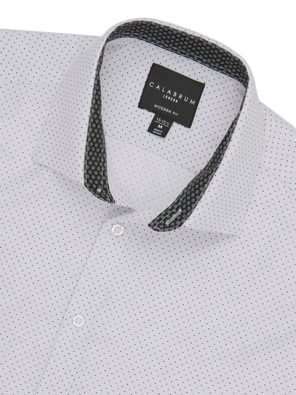 White shirt with black patterned collar and Calbrum label on a white background