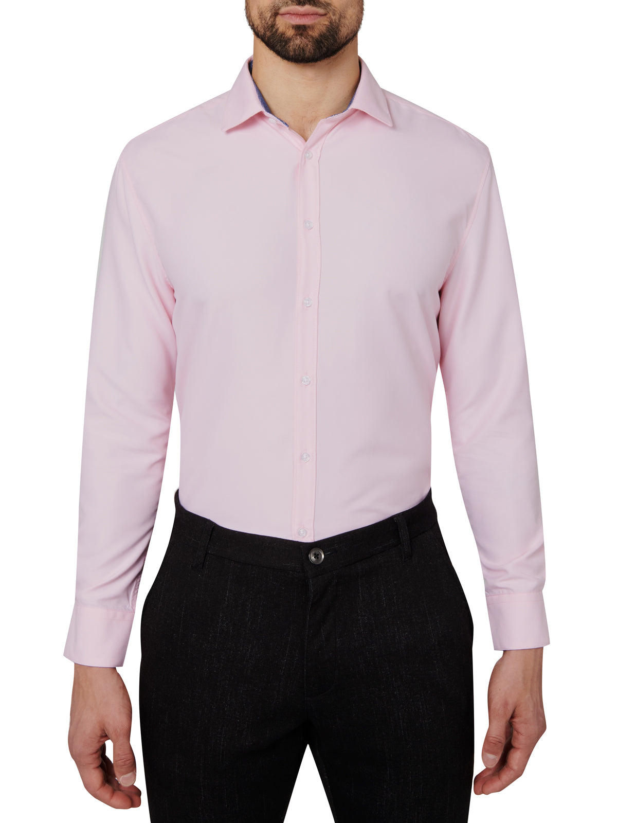 Man wearing a light pink dress shirt and black pants on a white background
