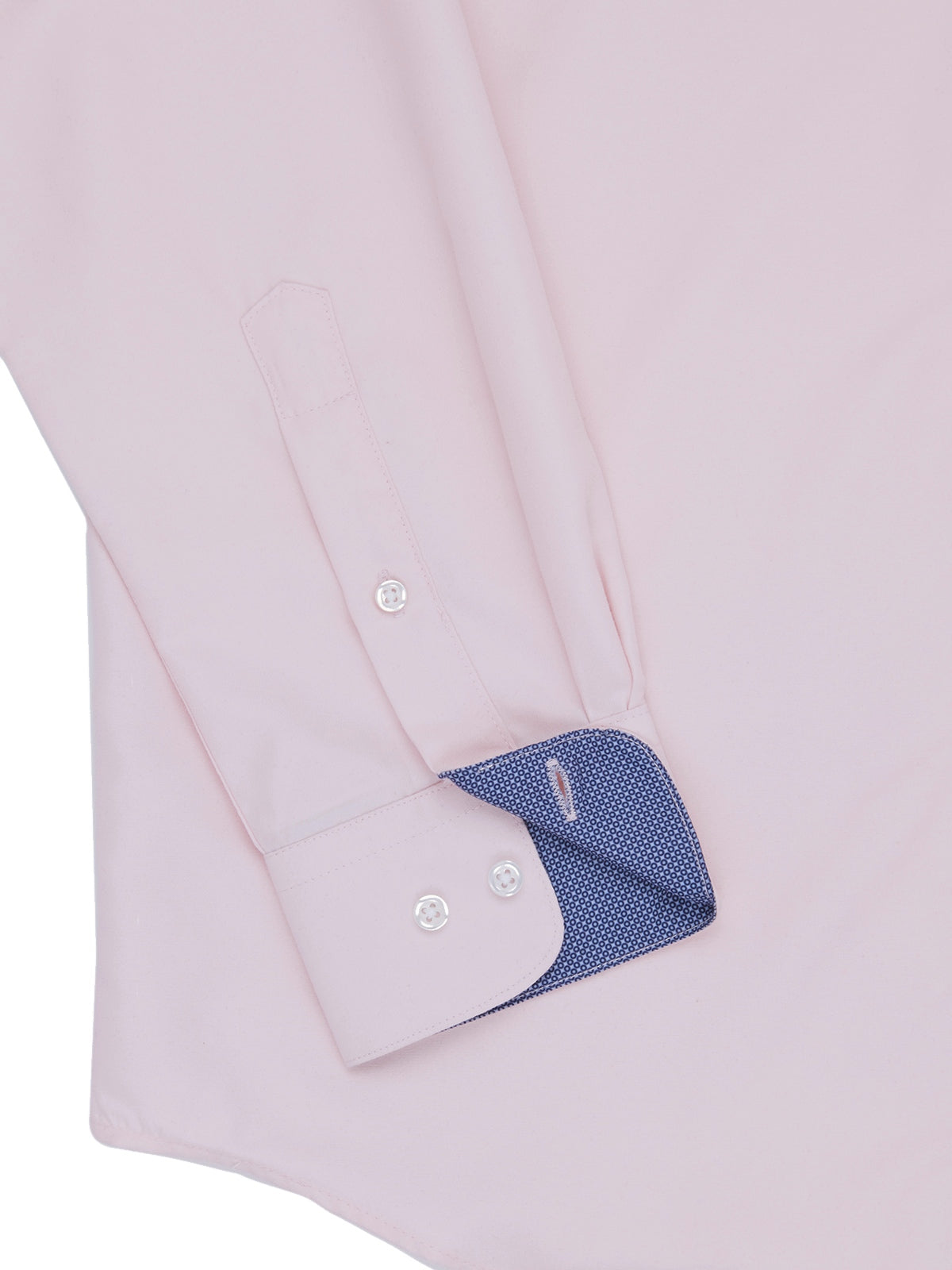 Close-up of a light pink dress shirt with blue cuff and white buttons on a white background