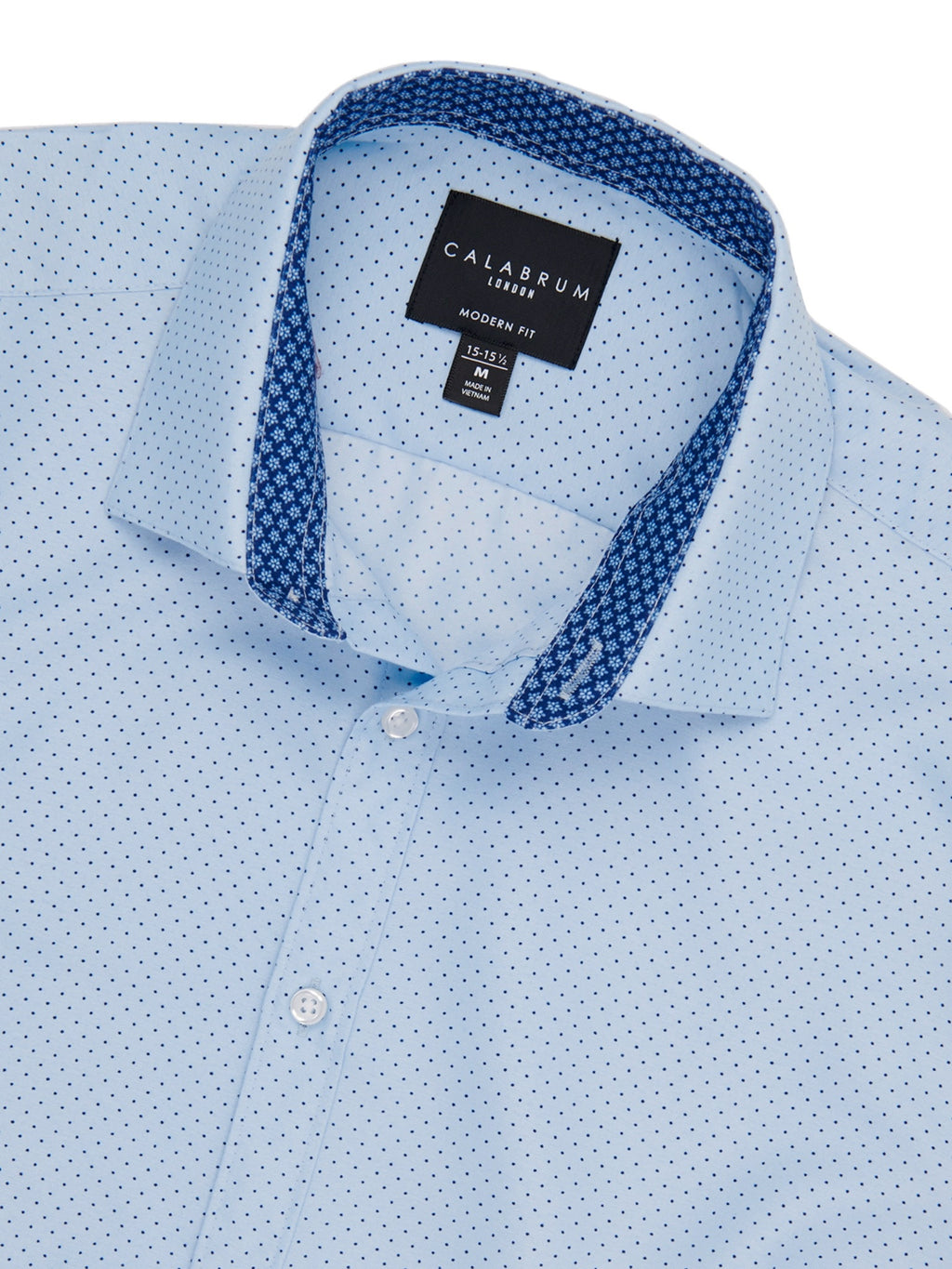 Light blue shirt with dark blue collar and trim, featuring a Calabrum label.