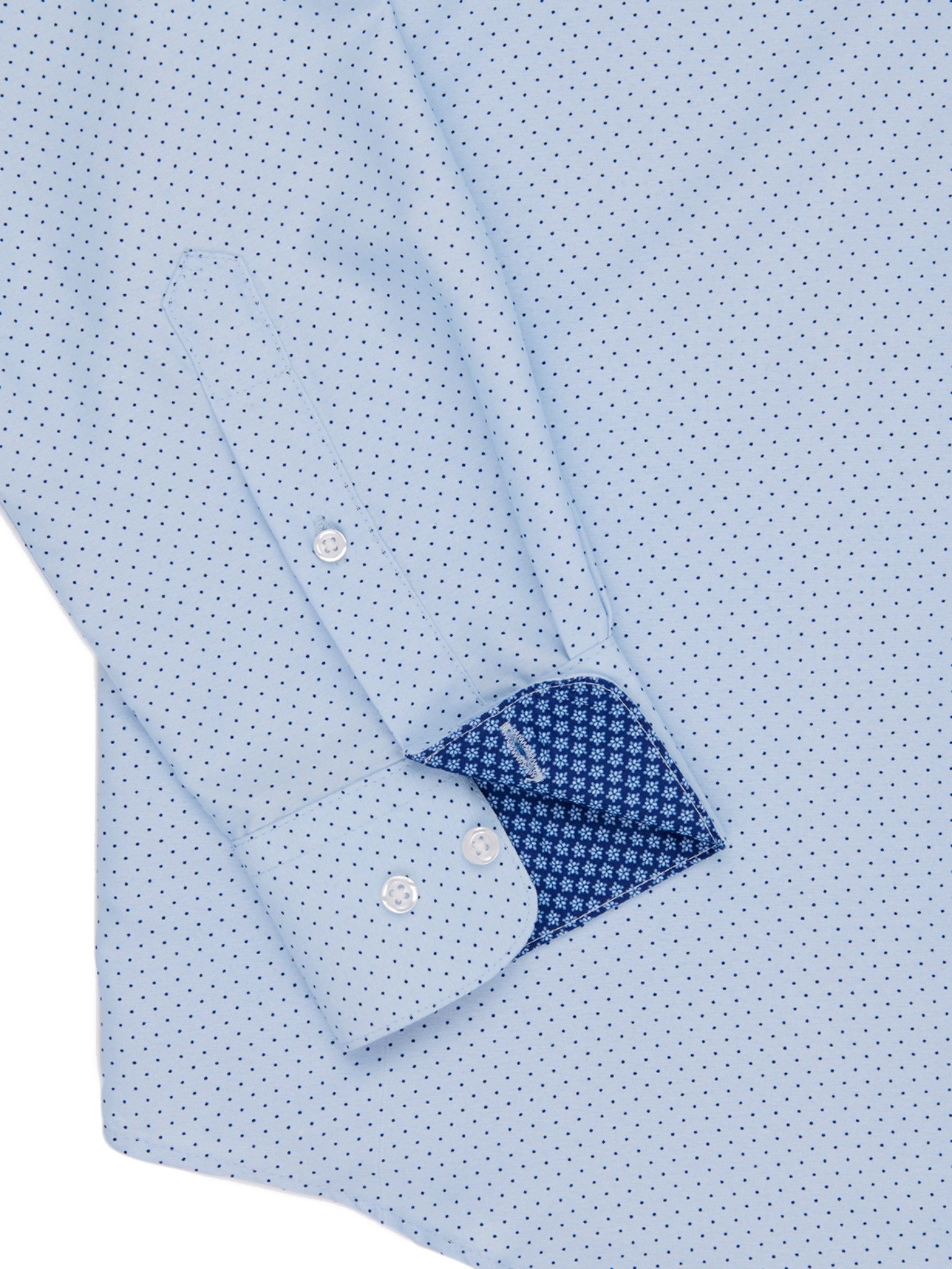 Close-up of a light blue shirt with a subtle pattern on a white background