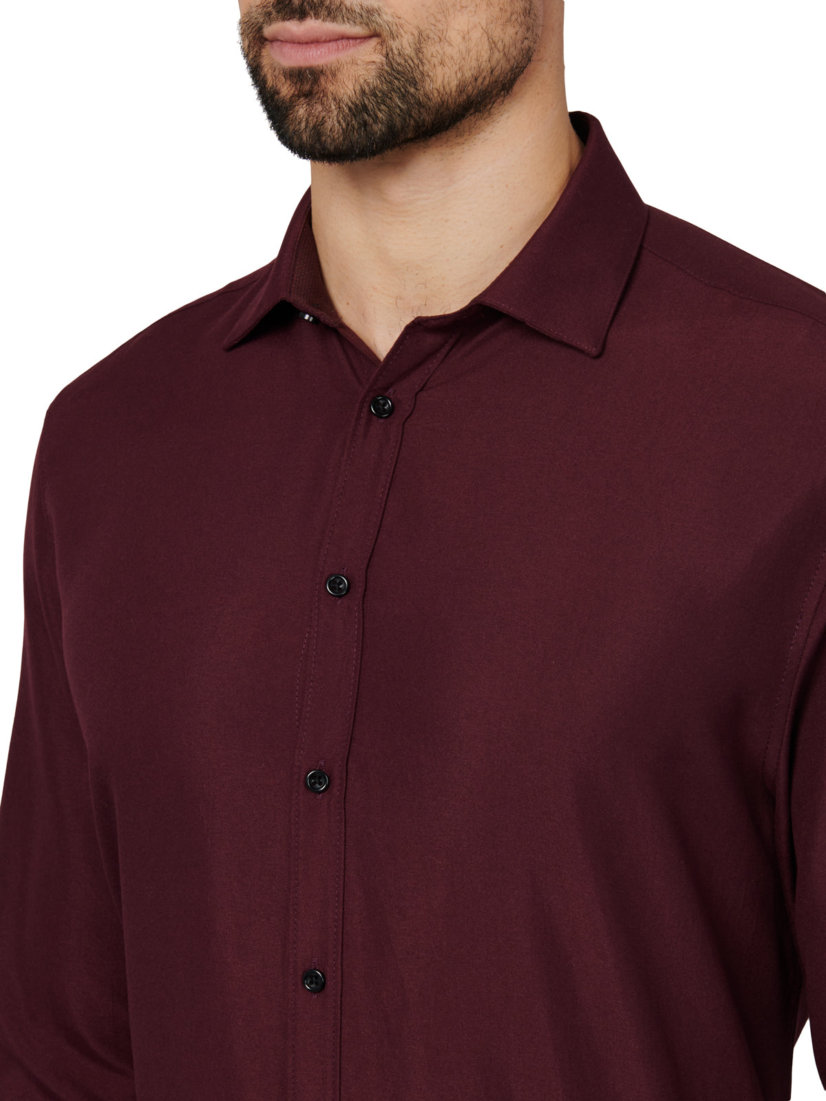 Maroon button-up shirt worn by a person on a white background