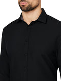 Black button-up shirt worn by a person on a white background