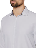 Light gray dress shirt worn by a person on a white background