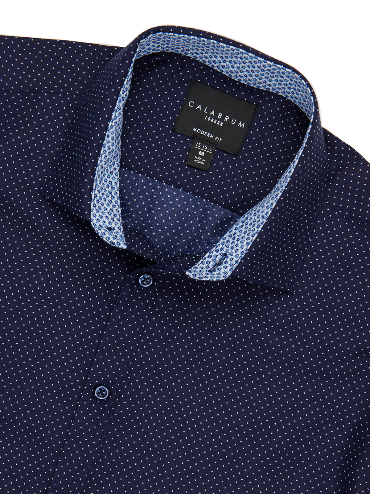 Navy blue shirt with white polka dot pattern and 'Calssrum' label on collar.